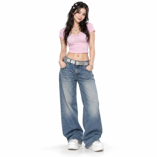 Full-body photo of a woman in a pink top and wide jeans